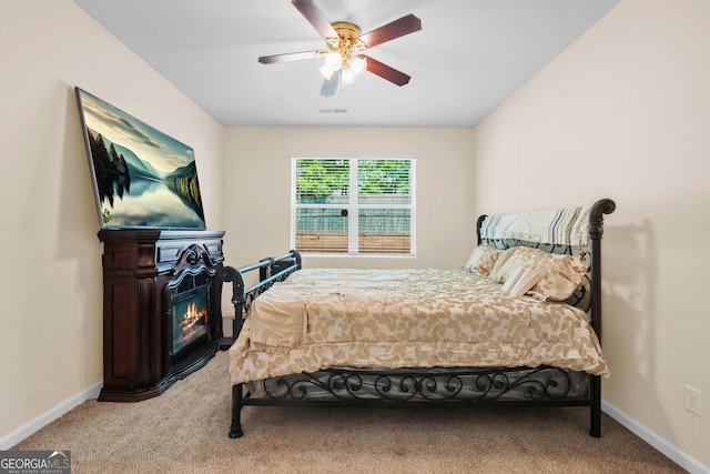 138 Yonah Way, Dallas, GA 30132 - carpeted bedroom with a glass covered fireplace and ceiling fan