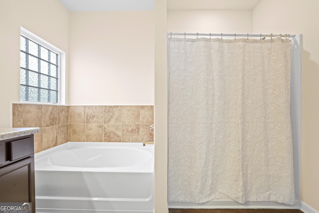 138 Yonah Way, Dallas, GA 30132 - full bathroom with a garden tub, vanity, and a shower with curtain