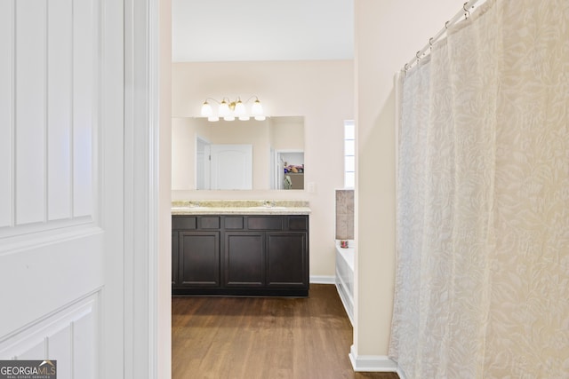 138 Yonah Way, Dallas, GA 30132 - bathroom with wood finished floors, vanity, a bath, and curtained shower