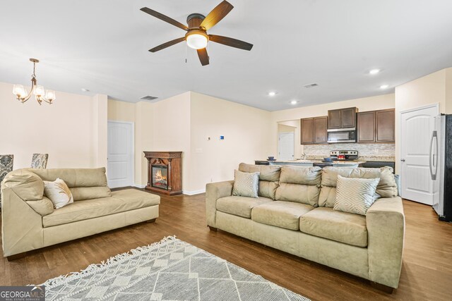 138 Yonah Way, Dallas, GA 30132 - living room with a ceiling fan, wood finished floors, recessed lighting, a chandelier, and baseboards