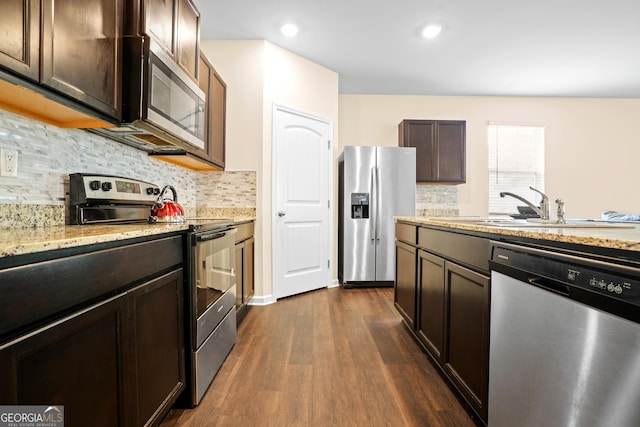 138 Yonah Way, Dallas, GA 30132 - kitchen featuring stainless steel appliances, dark wood finished floors, dark brown cabinets, tasteful backsplash, and recessed lighting