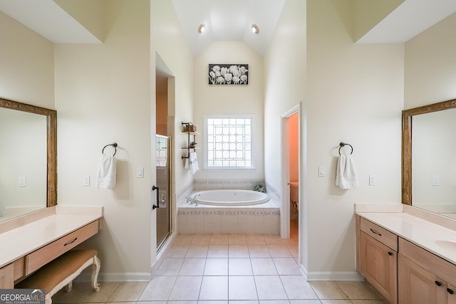 full bath featuring a stall shower, a bath, vaulted ceiling, tile patterned floors, and vanity