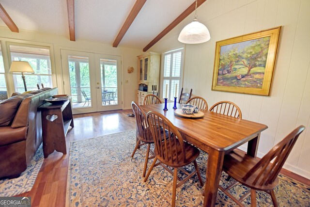 66 Pine Ridge Ct, Ellijay, GA 30536 - dining room with wood finished floors, beamed ceiling, french doors, and a healthy amount of sunlight
