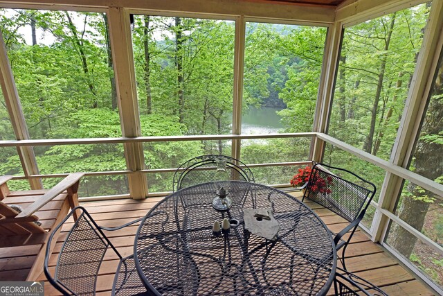 66 Pine Ridge Ct, Ellijay, GA 30536 - sunroom with a water view and outdoor dining area