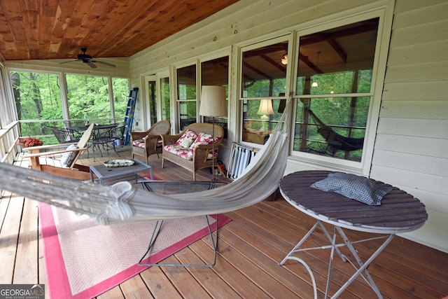 deck featuring a porch, a ceiling fan, and an outdoor hangout area
