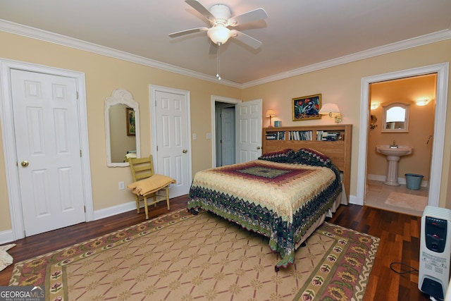 bedroom featuring crown molding, wood finished floors, a sink, baseboards, and heating unit