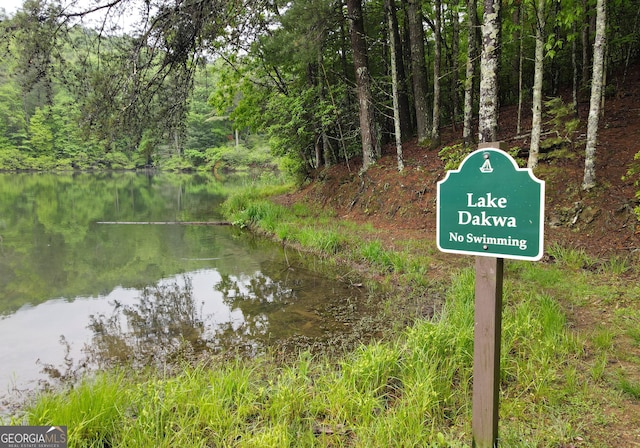 property view of water with a wooded view
