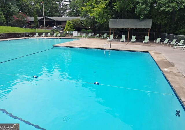 66 Pine Ridge Ct, Ellijay, GA 30536 - pool with a patio area and fence