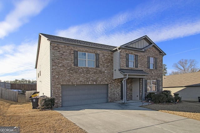 view of front facade featuring fence, an attached garage, concrete driveway, and brick siding