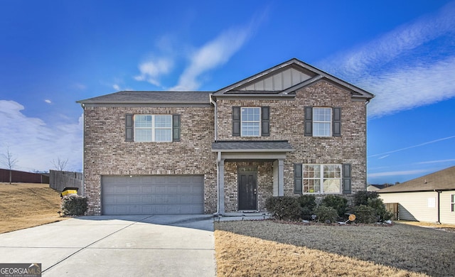 view of front facade featuring concrete driveway, brick siding, and an attached garage