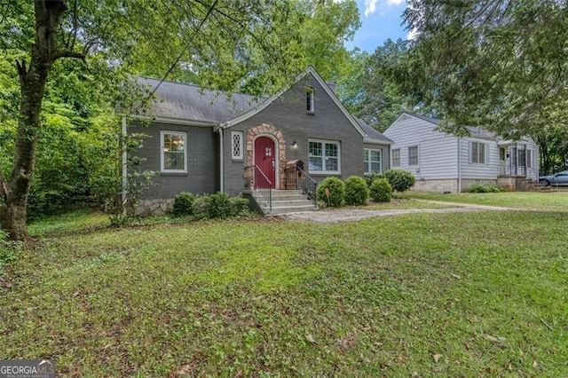 2607 Jefferson Ter, Atlanta, GA 30344 - view of front facade featuring a front yard and brick siding