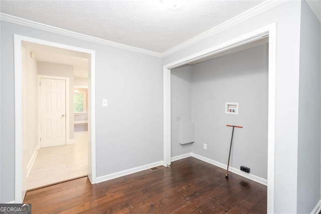 2607 Jefferson Ter, Atlanta, GA 30344 - washroom featuring washer hookup, wood finished floors, a textured ceiling, and crown molding