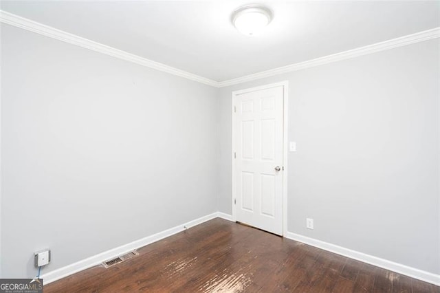 2607 Jefferson Ter, Atlanta, GA 30344 - spare room with dark wood-style floors and crown molding