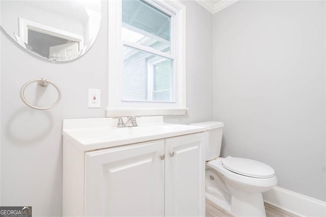 2607 Jefferson Ter, Atlanta, GA 30344 - bathroom with vanity, ornamental molding, and wood finished floors