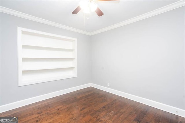 2607 Jefferson Ter, Atlanta, GA 30344 - empty room featuring a ceiling fan, built in shelves, ornamental molding, and dark wood-style floors