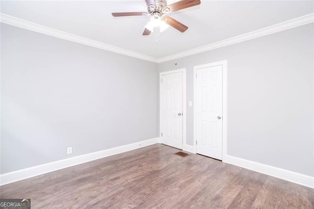 2607 Jefferson Ter, Atlanta, GA 30344 - unfurnished bedroom with wood finished floors, crown molding, and ceiling fan