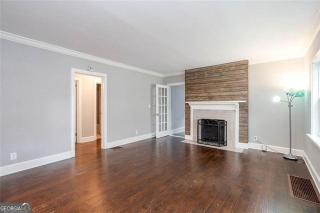 2607 Jefferson Ter, Atlanta, GA 30344 - unfurnished living room featuring ornamental molding, a fireplace, and hardwood / wood-style floors