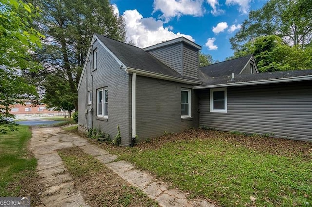 2607 Jefferson Ter, Atlanta, GA 30344 - view of side of property featuring brick siding and a lawn