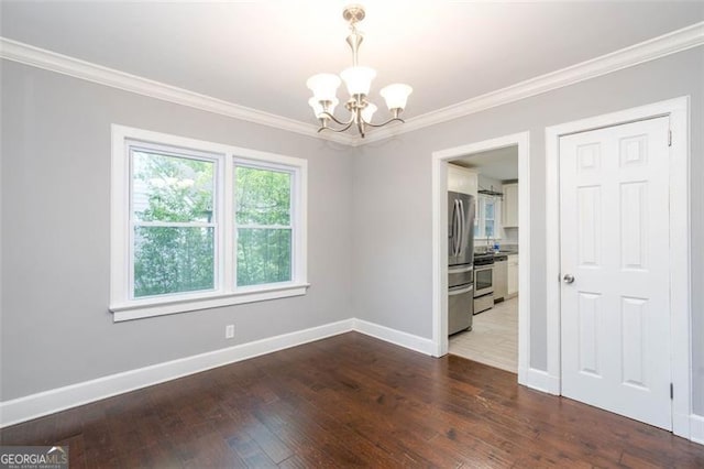 2607 Jefferson Ter, Atlanta, GA 30344 - empty room with a chandelier, ornamental molding, and dark wood-style floors