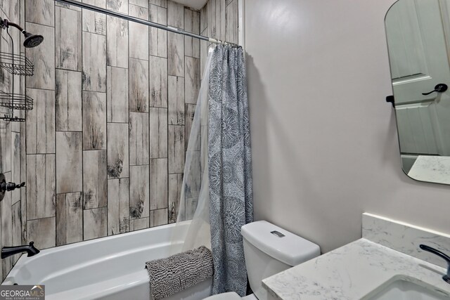 bathroom with shower / bath combo, toilet, and vanity