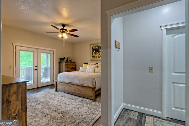 bedroom featuring wood finished floors, access to exterior, french doors, baseboards, and a ceiling fan