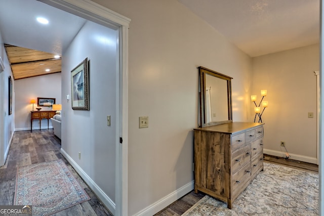 corridor with light wood-style flooring, baseboards, and recessed lighting