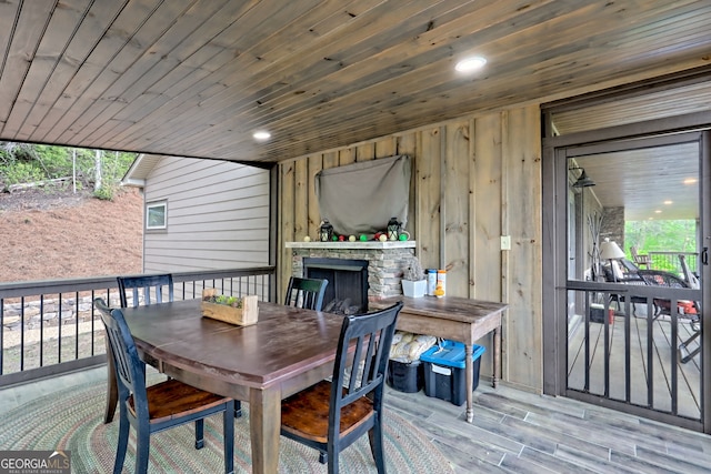 wooden terrace with outdoor dining area