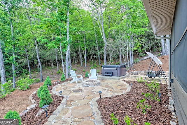 view of yard with a patio and an outdoor fire pit