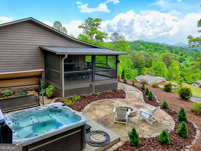 view of patio featuring a hot tub