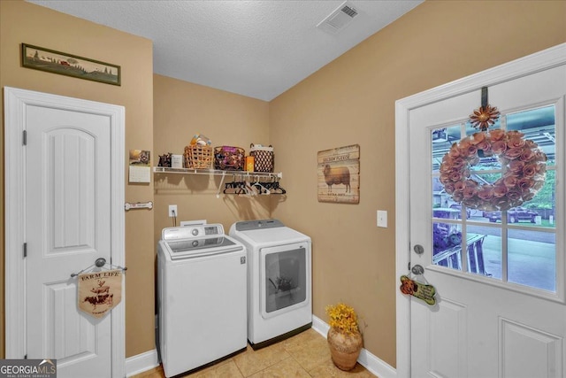 404 Hunts Landing Dr, Kathleen, GA 31047 - laundry room featuring laundry area, baseboards, light tile patterned floors, visible vents, and washer and clothes dryer