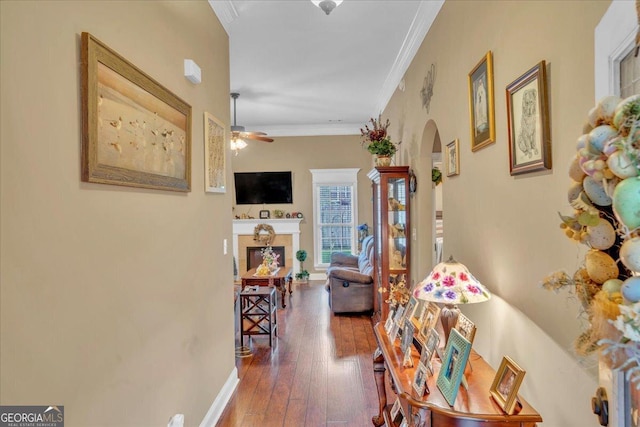 404 Hunts Landing Dr, Kathleen, GA 31047 - corridor with crown molding, arched walkways, baseboards, and hardwood / wood-style flooring
