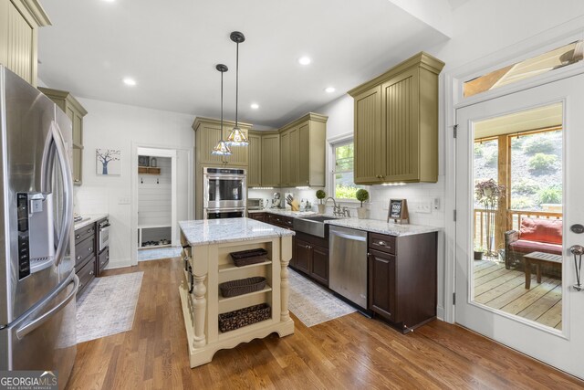 112 Pebblebrooke Run, Canton, GA 30115 - kitchen with open shelves, wood finished floors, tasteful backsplash, a sink, and stainless steel appliances