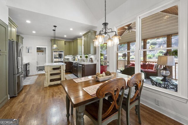 112 Pebblebrooke Run, Canton, GA 30115 - dining area with recessed lighting, baseboards, wood finished floors, and lofted ceiling