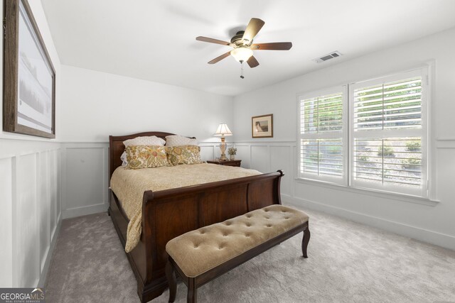 112 Pebblebrooke Run, Canton, GA 30115 - carpeted bedroom with visible vents, a ceiling fan, a decorative wall, and a wainscoted wall