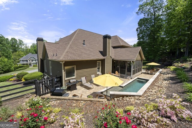 112 Pebblebrooke Run, Canton, GA 30115 - rear view of house with roof with shingles, a chimney, a sunroom, and a patio area