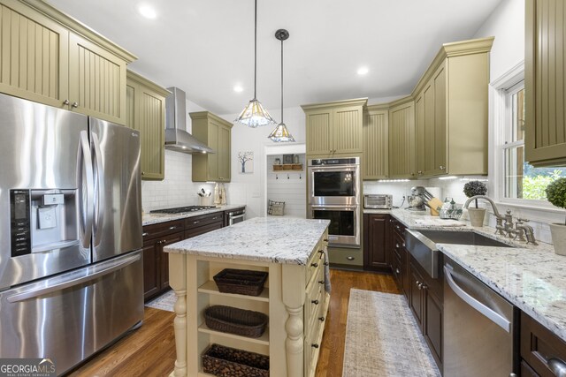 112 Pebblebrooke Run, Canton, GA 30115 - kitchen featuring a sink, cream cabinetry, wall chimney range hood, and stainless steel appliances