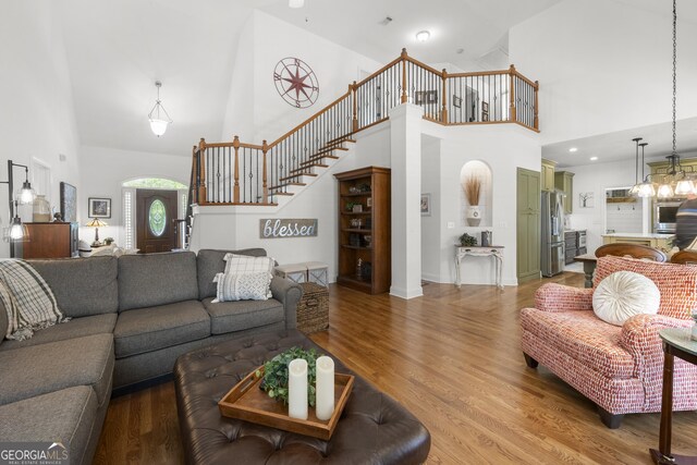 112 Pebblebrooke Run, Canton, GA 30115 - living room featuring stairs, high vaulted ceiling, and light wood-style flooring