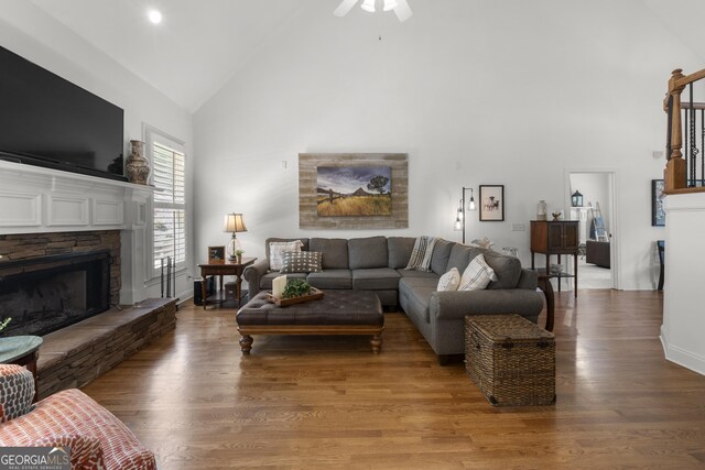 112 Pebblebrooke Run, Canton, GA 30115 - living room with a ceiling fan, a fireplace, high vaulted ceiling, baseboards, and light wood finished floors