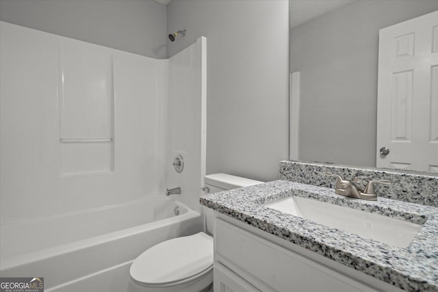 bathroom with vanity, toilet, and bathtub / shower combination