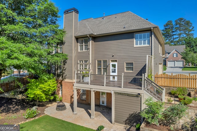 3641 Carriage Glen Way, Dacula, GA 30019 - back of house featuring a patio, a wooden deck, a chimney, an outdoor fire pit, and stairs