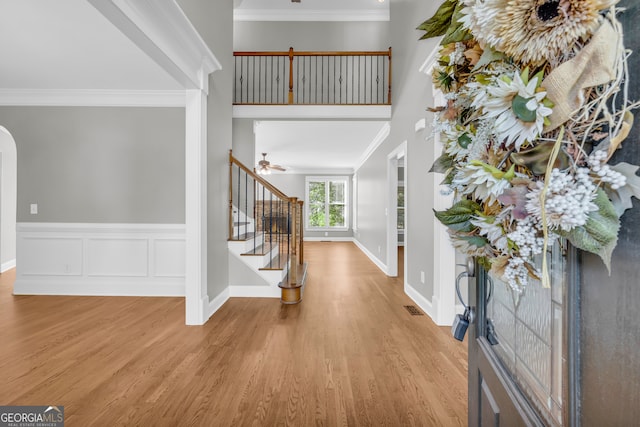 3641 Carriage Glen Way, Dacula, GA 30019 - entrance foyer with stairway, wood finished floors, ornamental molding, arched walkways, and baseboards