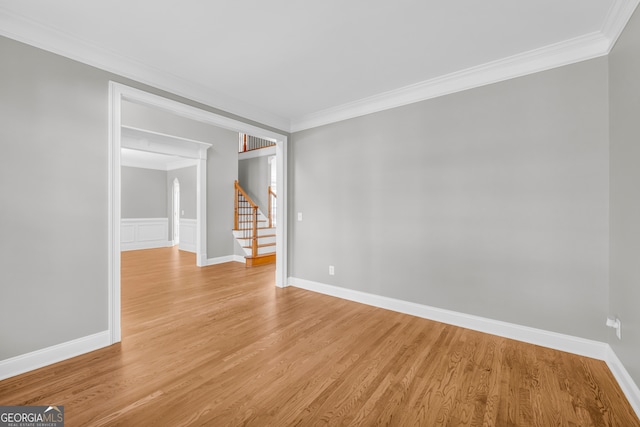 3641 Carriage Glen Way, Dacula, GA 30019 - spare room featuring crown molding, light wood-style flooring, stairs, and baseboards