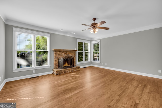 3641 Carriage Glen Way, Dacula, GA 30019 - unfurnished living room featuring healthy amount of natural light, a ceiling fan, baseboards, ornamental molding, and a fireplace