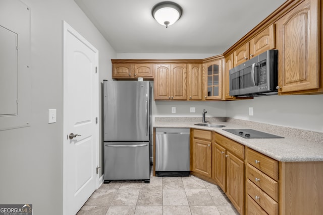 3641 Carriage Glen Way, Dacula, GA 30019 - kitchen featuring stainless steel appliances, a sink, glass insert cabinets, light countertops, and brown cabinets