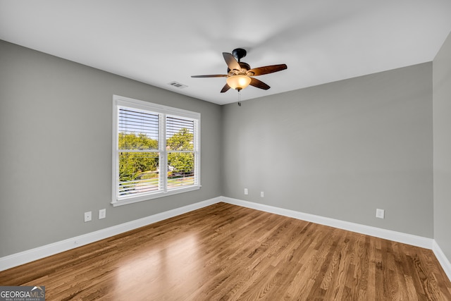 3641 Carriage Glen Way, Dacula, GA 30019 - spare room featuring baseboards, ceiling fan, and wood finished floors