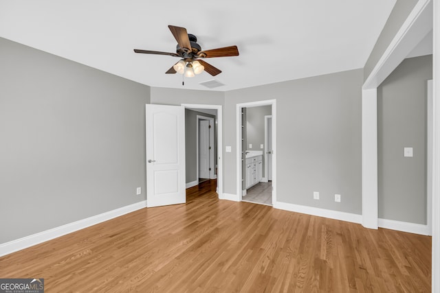 3641 Carriage Glen Way, Dacula, GA 30019 - unfurnished bedroom with baseboards, light wood-type flooring, ensuite bathroom, and a ceiling fan