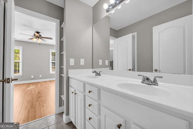3641 Carriage Glen Way, Dacula, GA 30019 - bathroom with double vanity, a ceiling fan, baseboards, and tile patterned floors