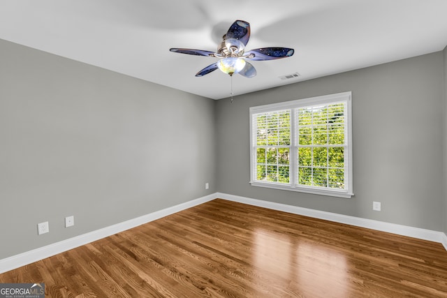3641 Carriage Glen Way, Dacula, GA 30019 - spare room with baseboards, a ceiling fan, and wood finished floors