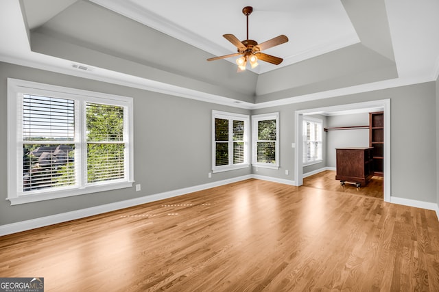 3641 Carriage Glen Way, Dacula, GA 30019 - unfurnished living room featuring a raised ceiling, a ceiling fan, baseboards, and crown molding