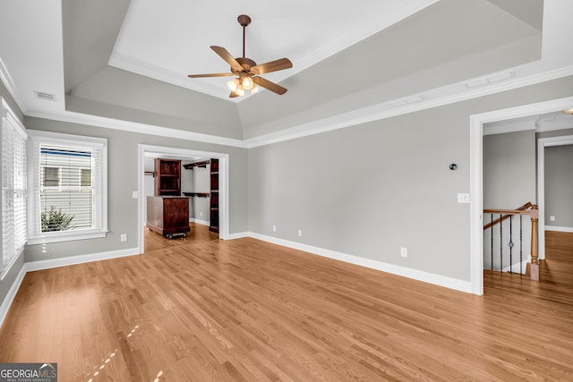 3641 Carriage Glen Way, Dacula, GA 30019 - empty room featuring a raised ceiling, a ceiling fan, light wood finished floors, ornamental molding, and baseboards
